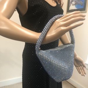 Cache mini bag with blue rhinestones.
